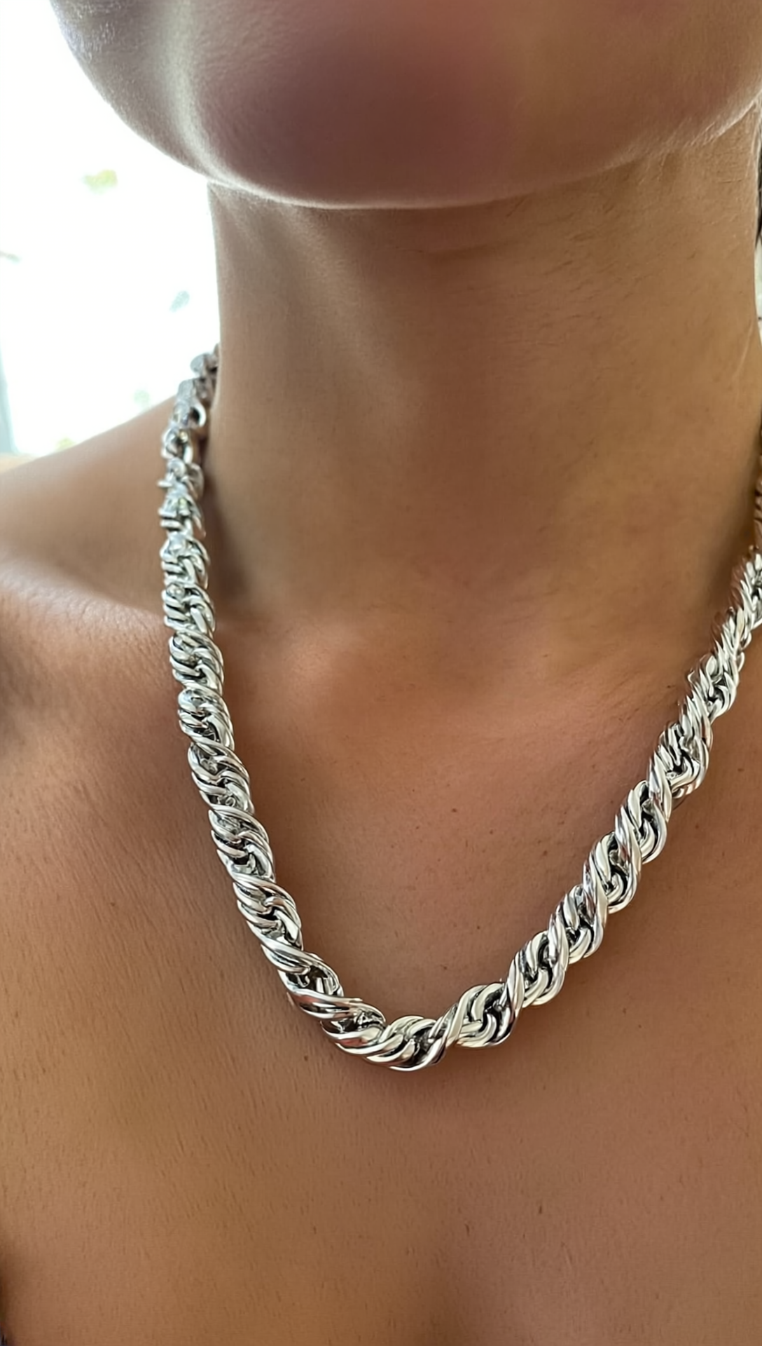 Twisted rope figaro chain necklace worn on neckline
